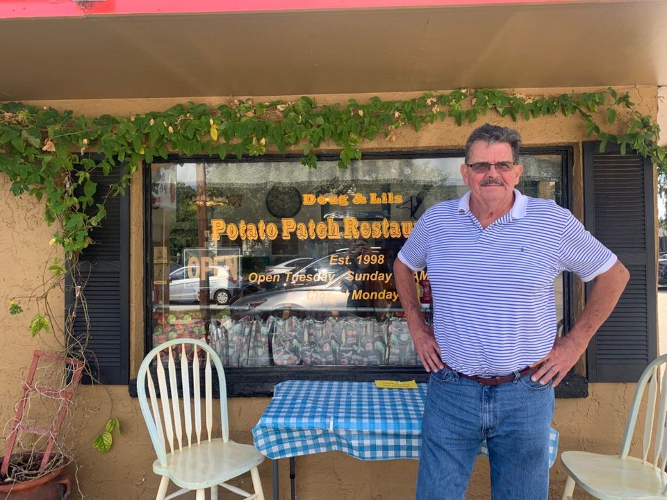 A01 doug in front of restaurant scaled
