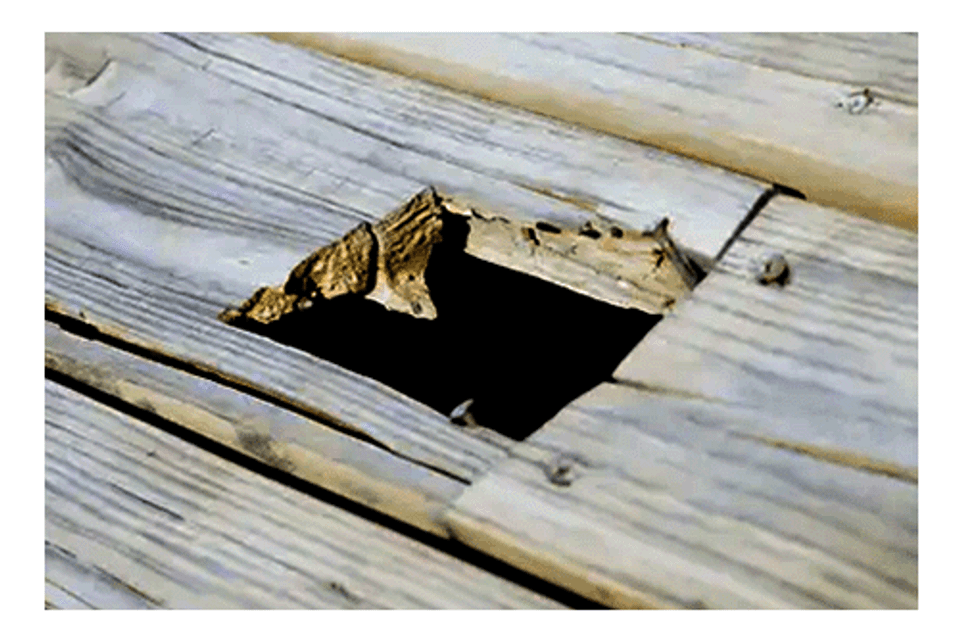 Hole in wooden patio