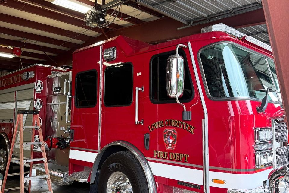 Lower Currituck Fire Department engine getting window tint installed in the shop bay