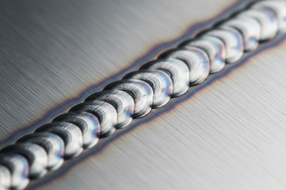 Precision TIG welding bead on stainless steel showcasing high-quality custom fabrication