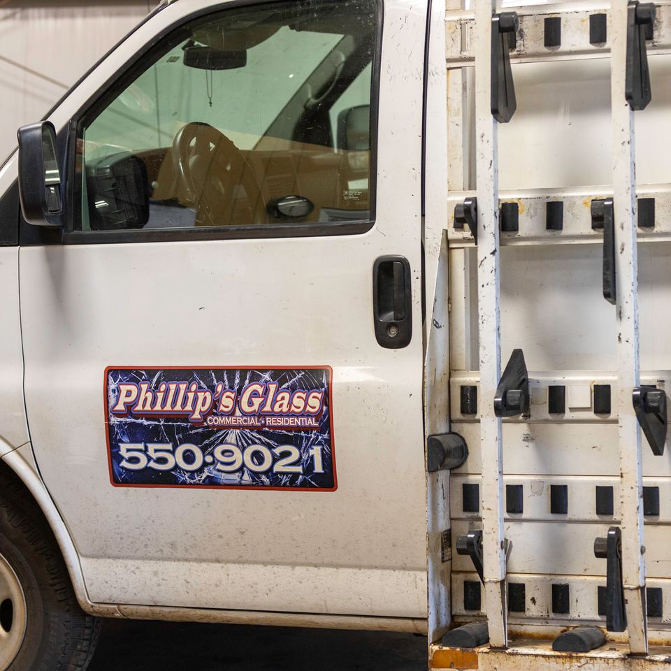 Phillip’s Glass service truck with an exterior glass rack inside the Edmond shop