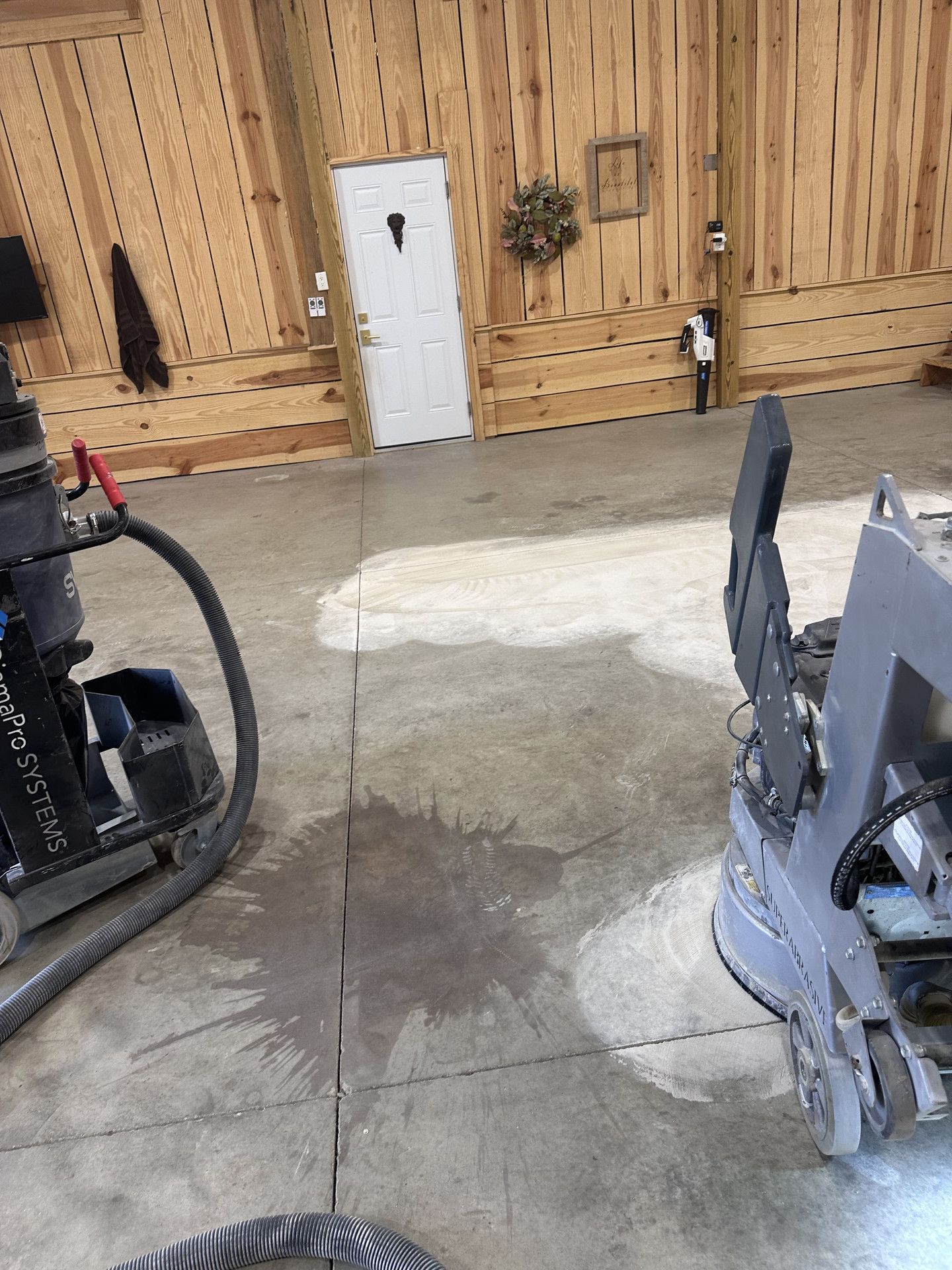 Before: equipment visible while garage floor work was in progress