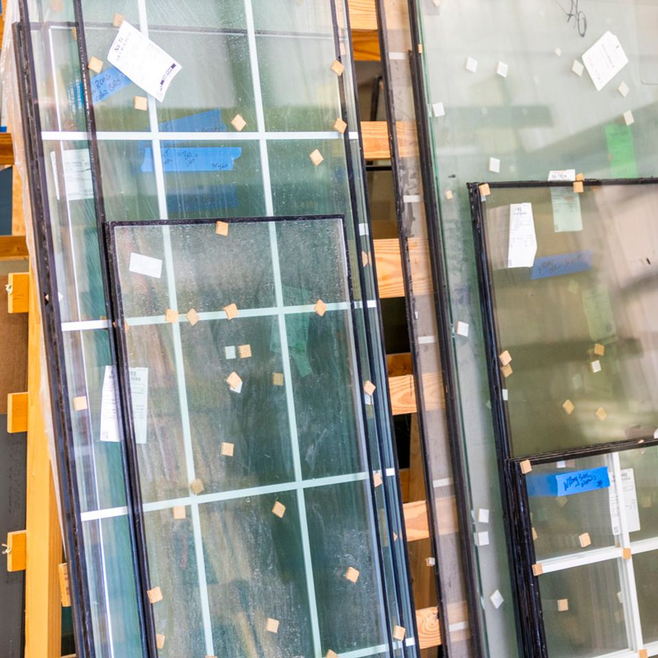 Insulated window glass units stored on racks inside the Phillip’s Glass shop