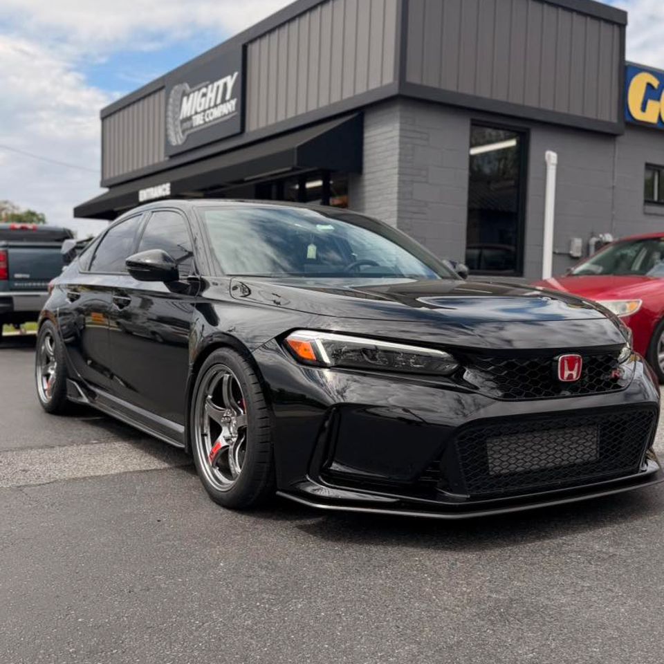 Black Honda Civic Type R with chrome wheels parked outside Mighty Tire Company in Claymont DE