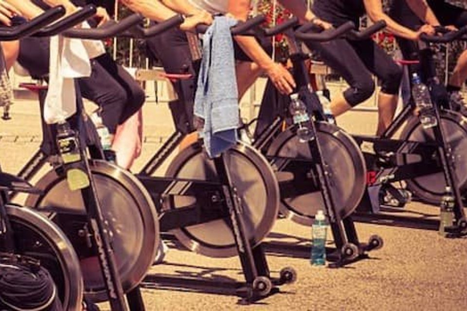 Spin class with all the participants lined up taken from the waist down 