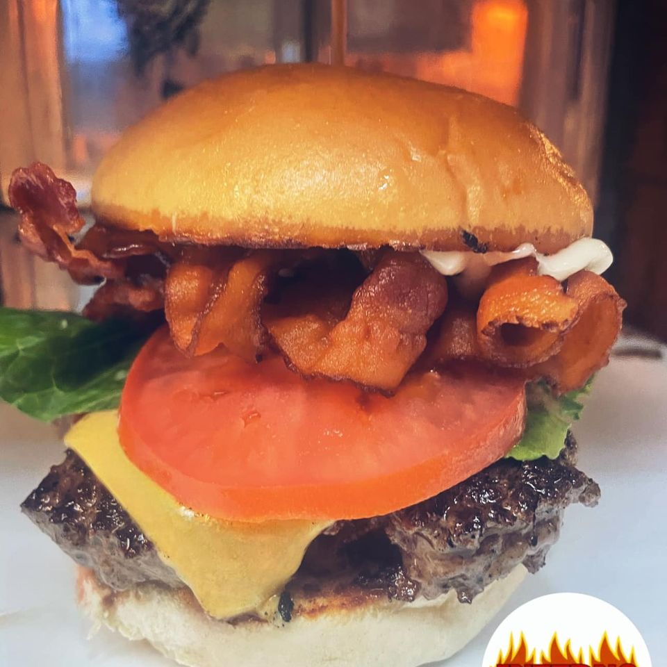 Cheeseburger with tomato, lettuce and bacon at Inferno The Restaurant in Sound Beach