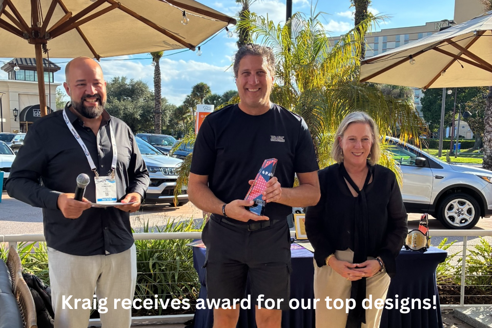 Kraig receiving award for our top designs! b k designs