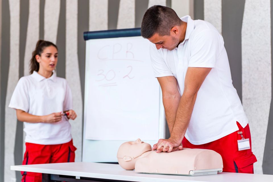 CPR instructors teaching with a dummy
