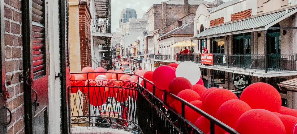 VIP balcony at The Swamp, 520 Bourbon Street, decorated for a Carpe Diem Events balcony party overlooking Bourbon Street.