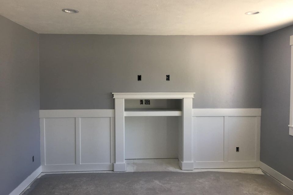 Family room fireplace and wall before