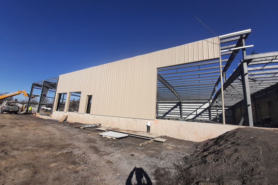 Large-scale warehouse construction project in progress.