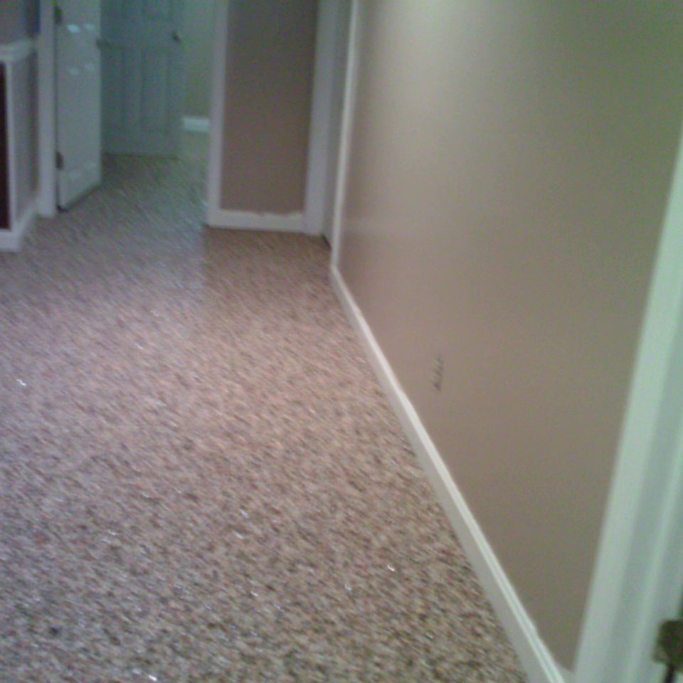 Basement hallway finished with an EverStone decorative stone floor.