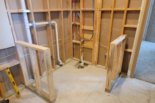 Stud framing and supply lines roughed‑in for renovated bath in Willis, TX