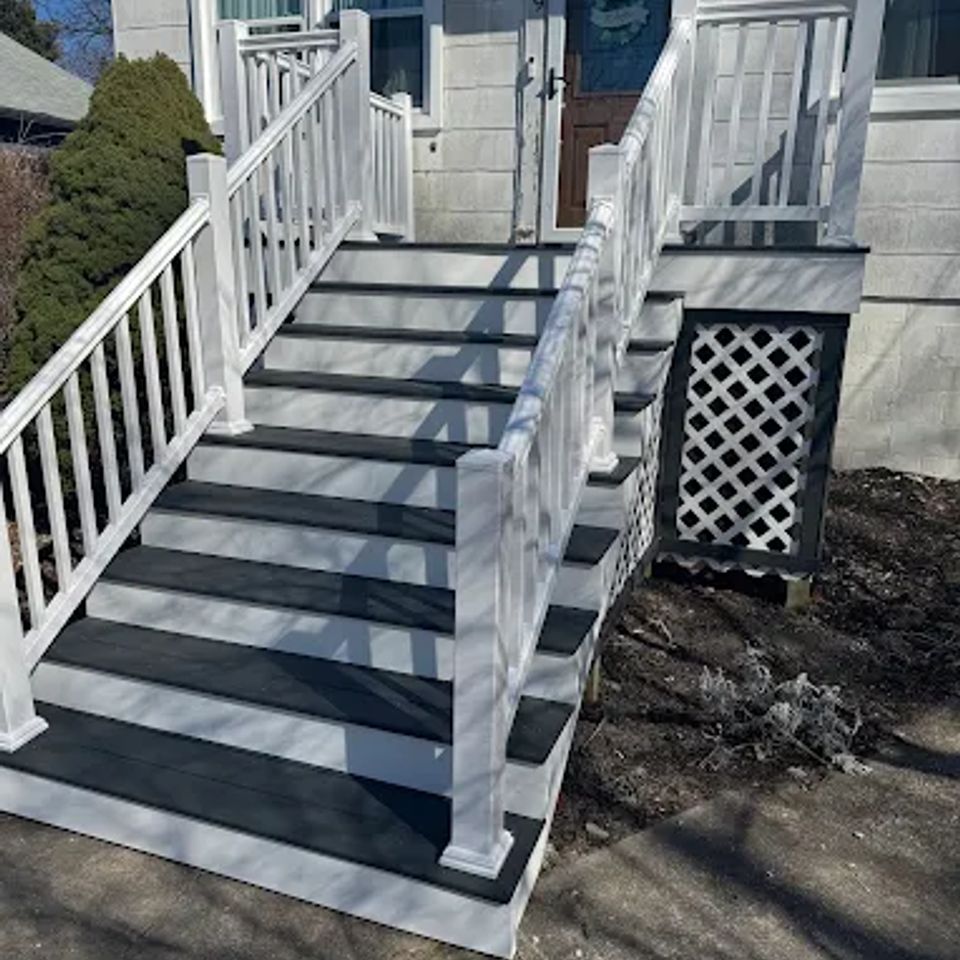 Deck leading up to the door outside in the bright sun done by Taurus Contracting