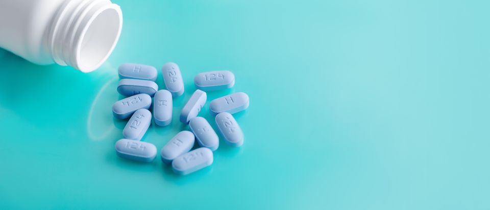 Blue prep pills on a teal surface  representing hiv prevention and doxypep for sti protection and safer sex care.