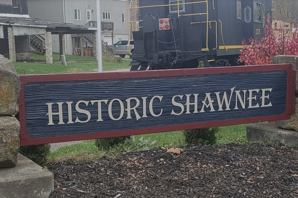 A sign with the name Historic Shawnee on it 