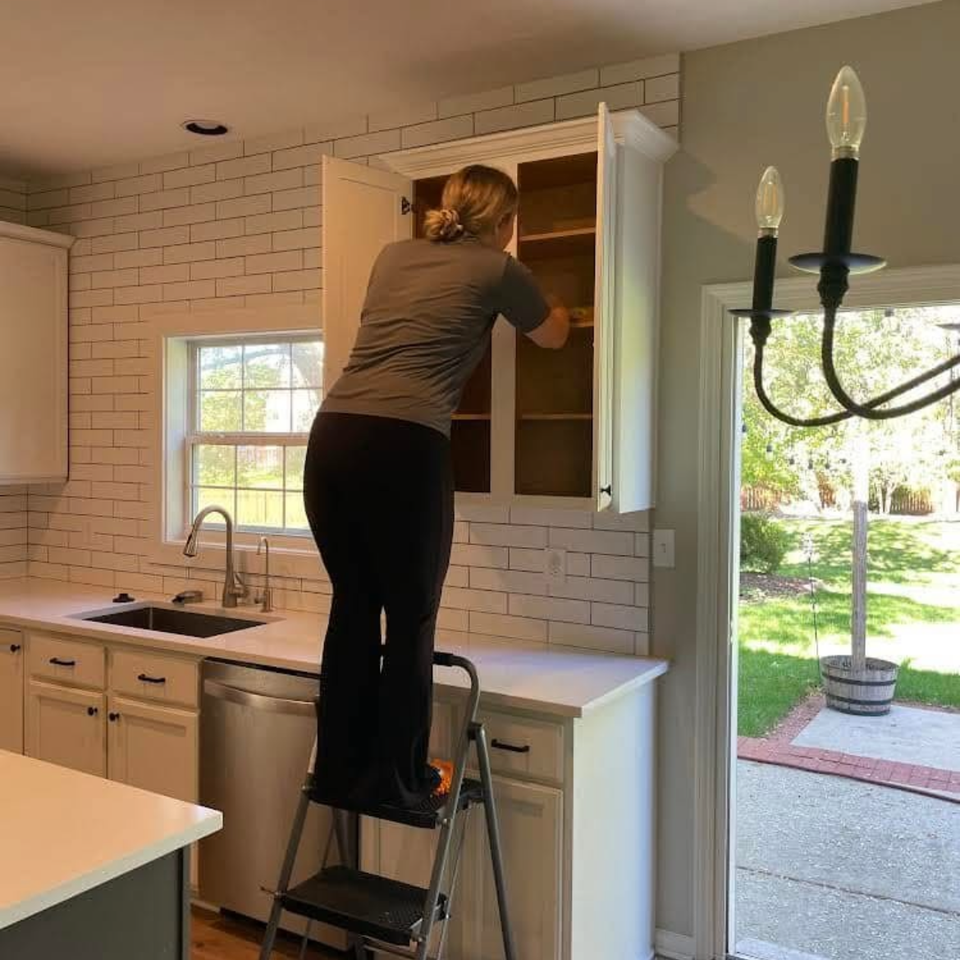 The team at Fishers Enhanced Cleaning in Fishers, IN cleans a kitchen cabinet
