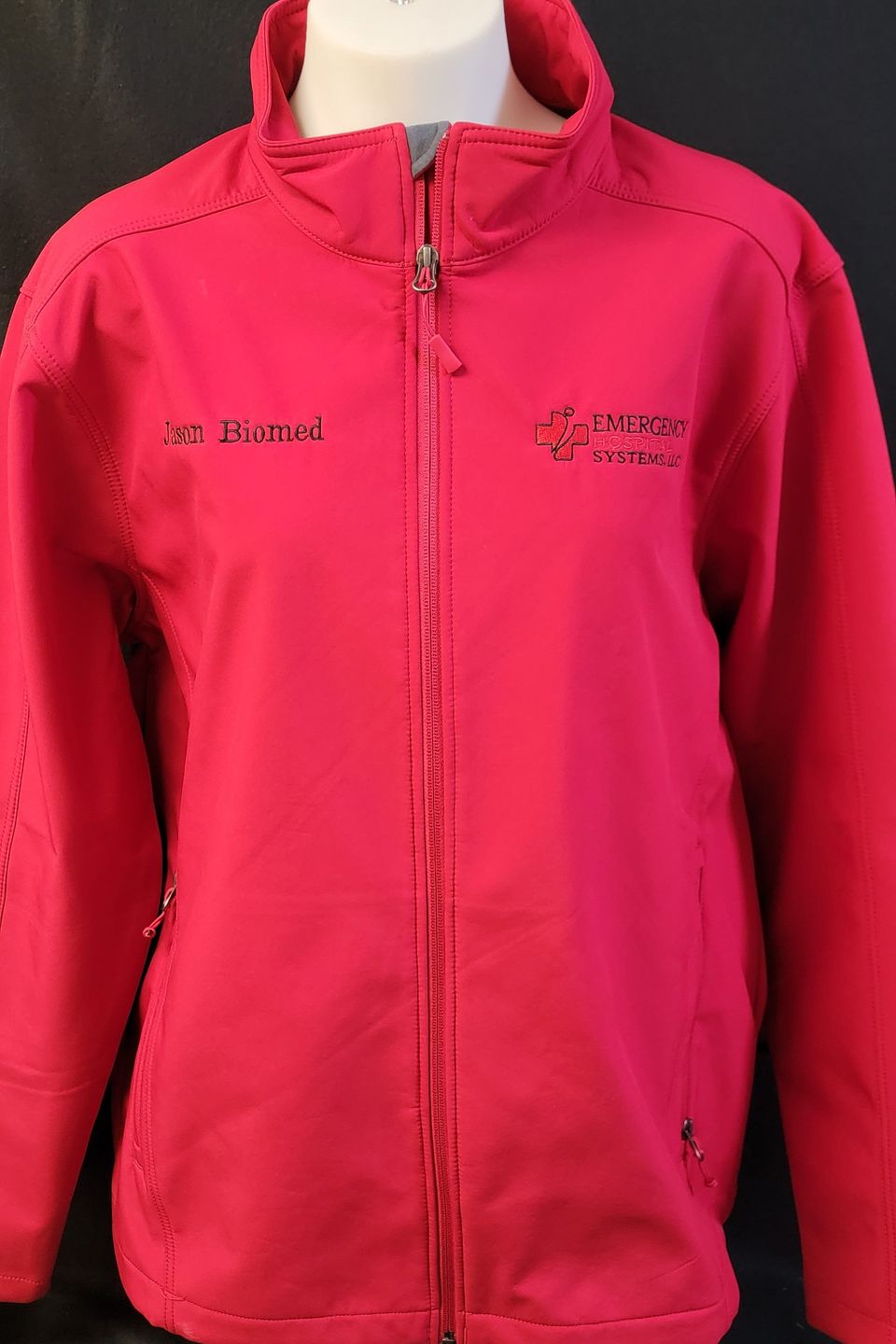 Embroidery logo example on red windbreaker jacket