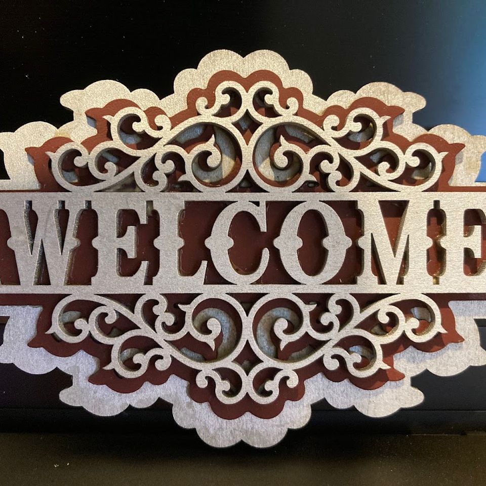 Welcome sign with leather inlay