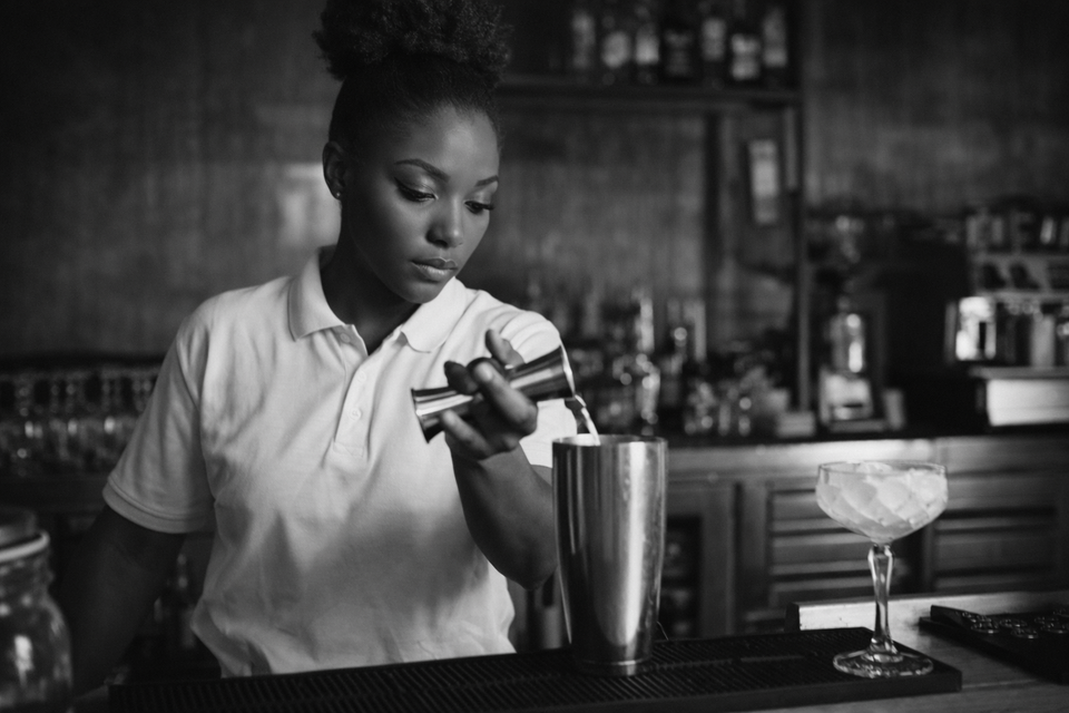 Focused bartender behind the bar
