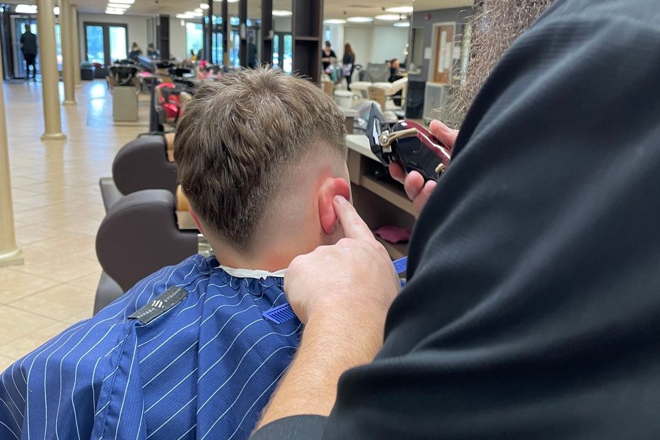 Cosmetology student practicing