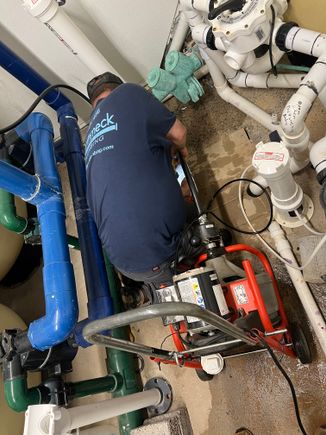 Kenny working in pool room fixing leak 2