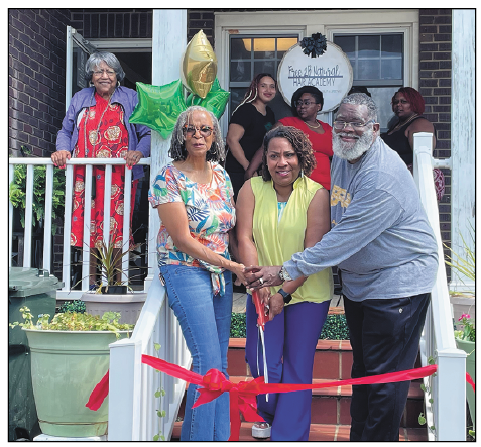 Yolanda George Harris, with GM and Instructor Nakima Clark-Bell, and Academic Coordinator Dr. Titus Hopper, cut the ribbon under Mom’s watchful eye (back left).
Photo by Loretta Cozart Screen shot 2025 07 10 at 11.31.35 am