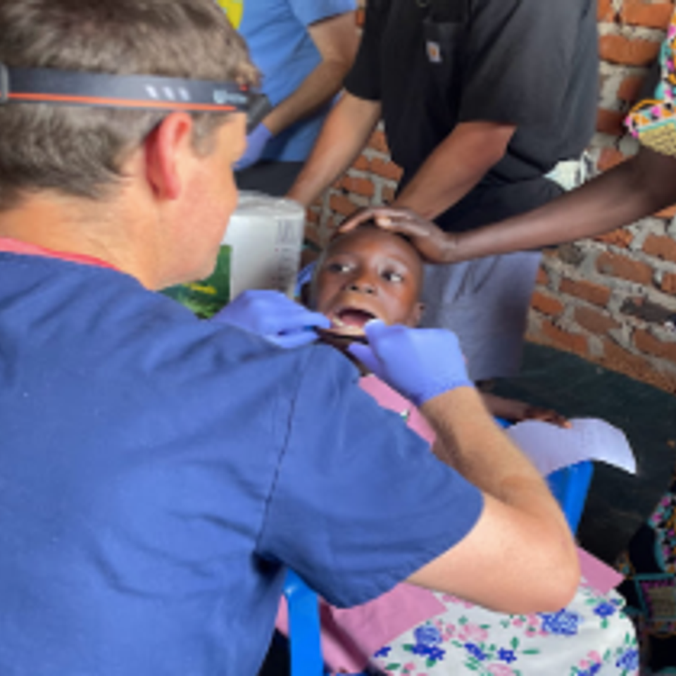 Dr. ferguson helping young patient