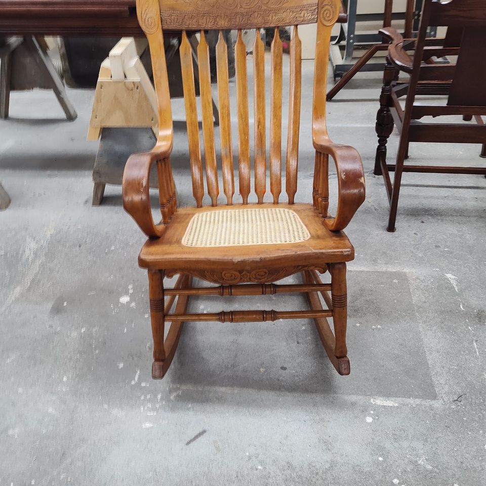 Re caned seat on rocking chair cs