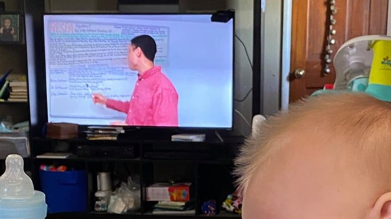 0dlokqjcsggel1xvzoan baby in a kitchen and lance teaching on computer screen
