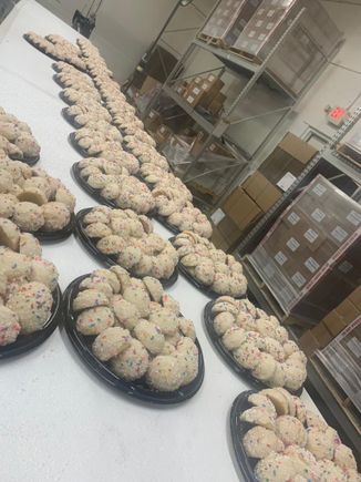 Multiple 2 pound platters of the Anisette Cookies from Toni's Own Cookies in the factory