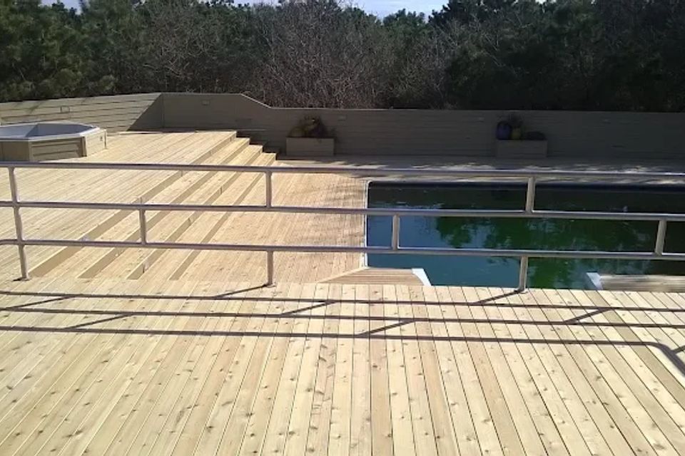 Newly installed deck with pool, done by Taurus Contracting of Suffolk County, NY