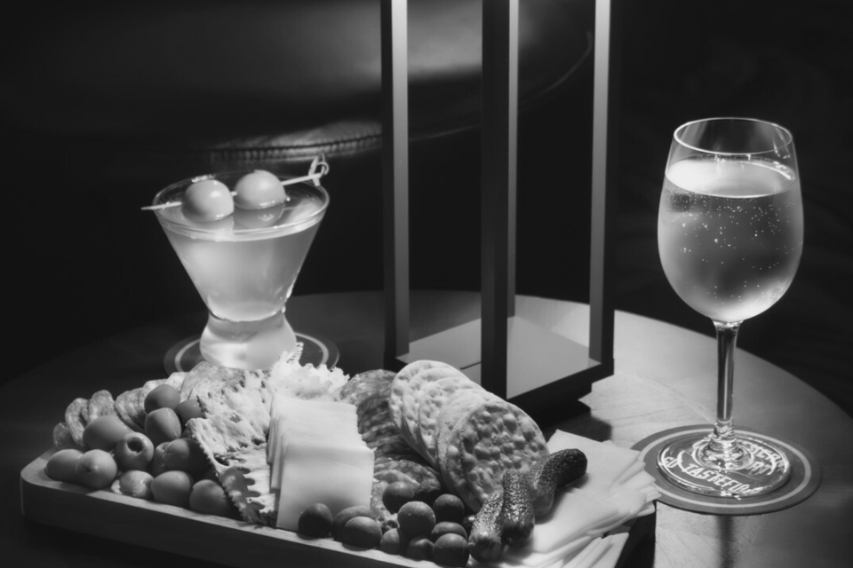 Signature Martini, wine glass and charcuterie board at Jilly's in Metairie, La.