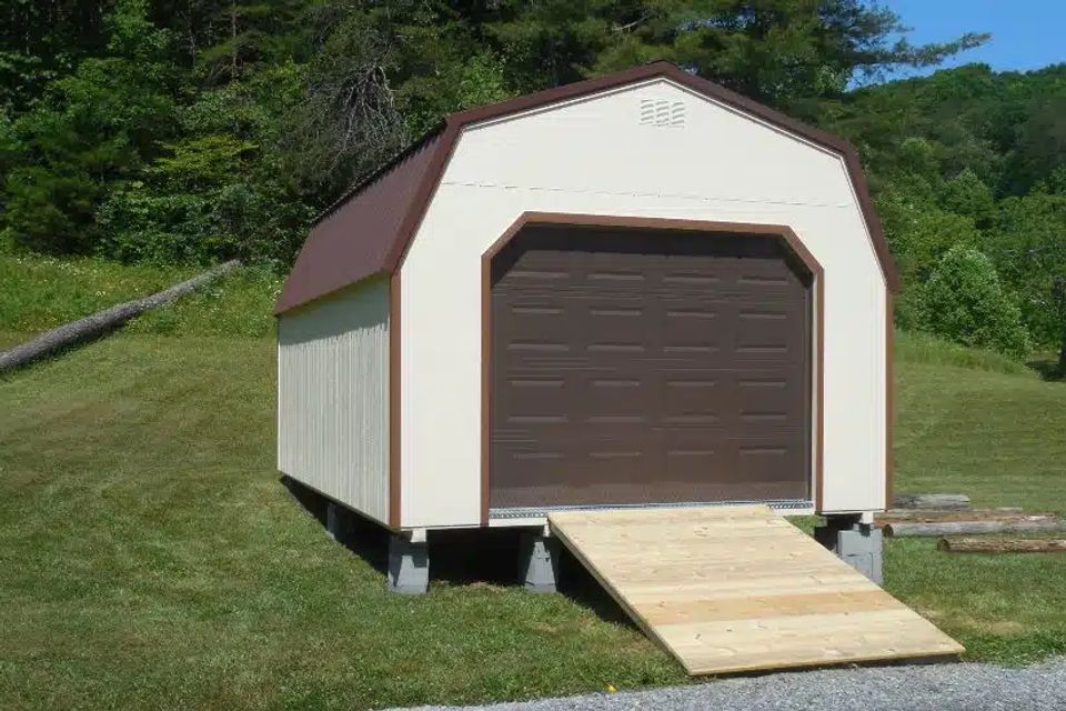 Cream and brown high wall garage with overhead door and wood ramp in Elizabethton TN