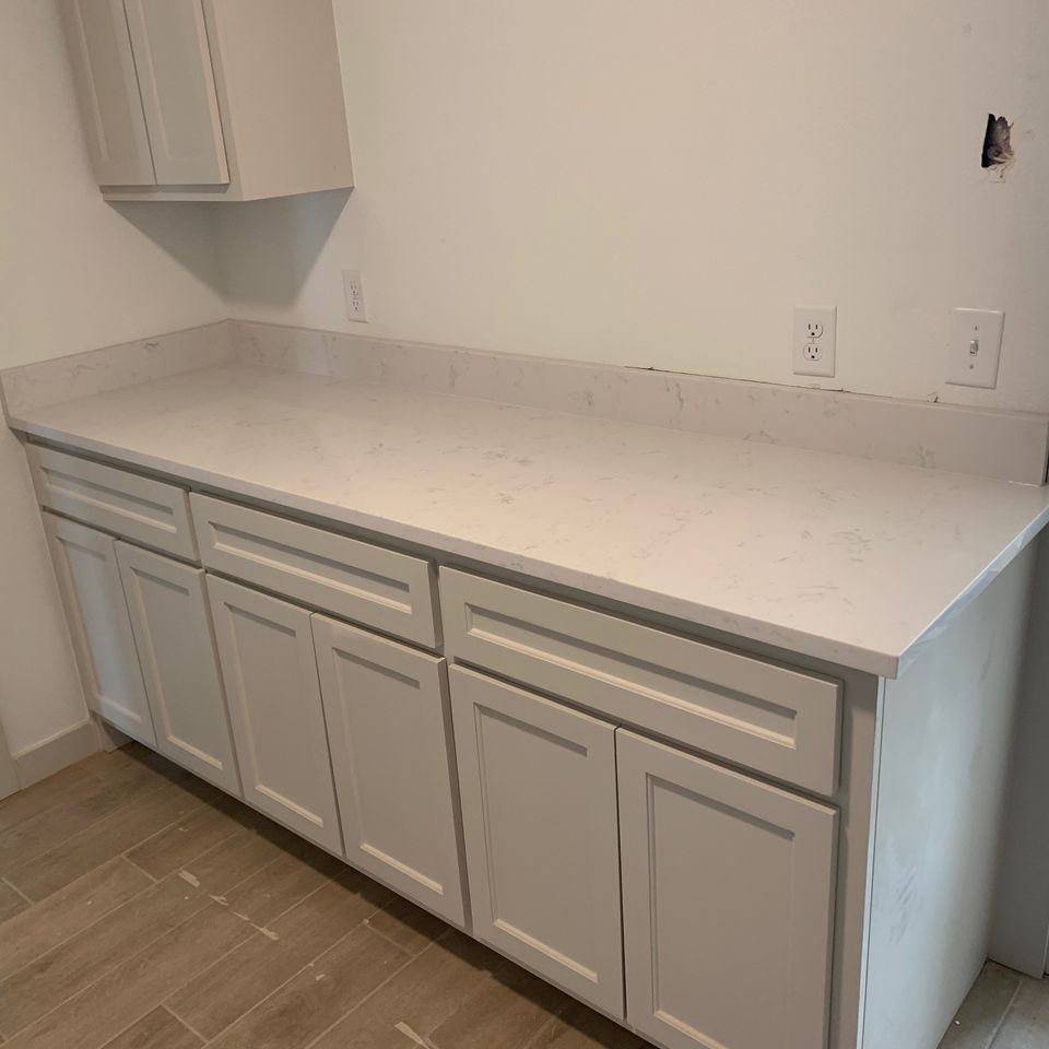 Granite planet  tulsa oklahoma  granite marble quartz countertop slab supplier fabricator installer company  quartz countertops tulsa  quartz laundry room cabinet top photo example  photo 28 02 2022  4 09 32 pm