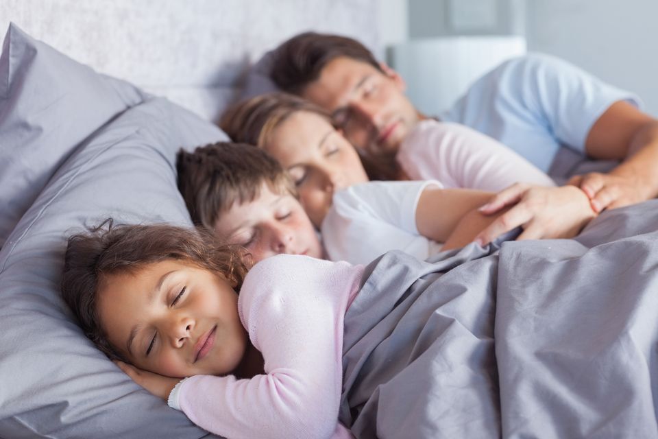Family sleeping comfortably thanks to clean indoor air, a high-efficiency HVAC system, and regular AC maintenance in Palm Springs and the Coachella Valley.