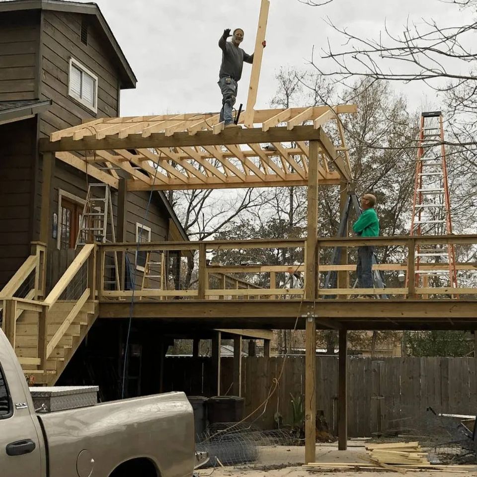 Framing of a raised deck covered patio under construction at a home in Spring TX