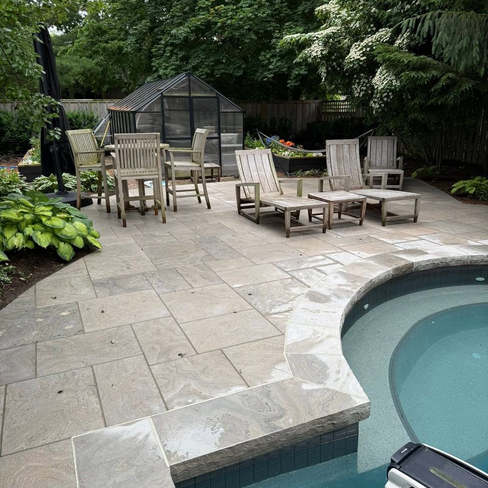 Freshly pressure washed stone pool deck and patio in a Tillsonburg Ontario backyard