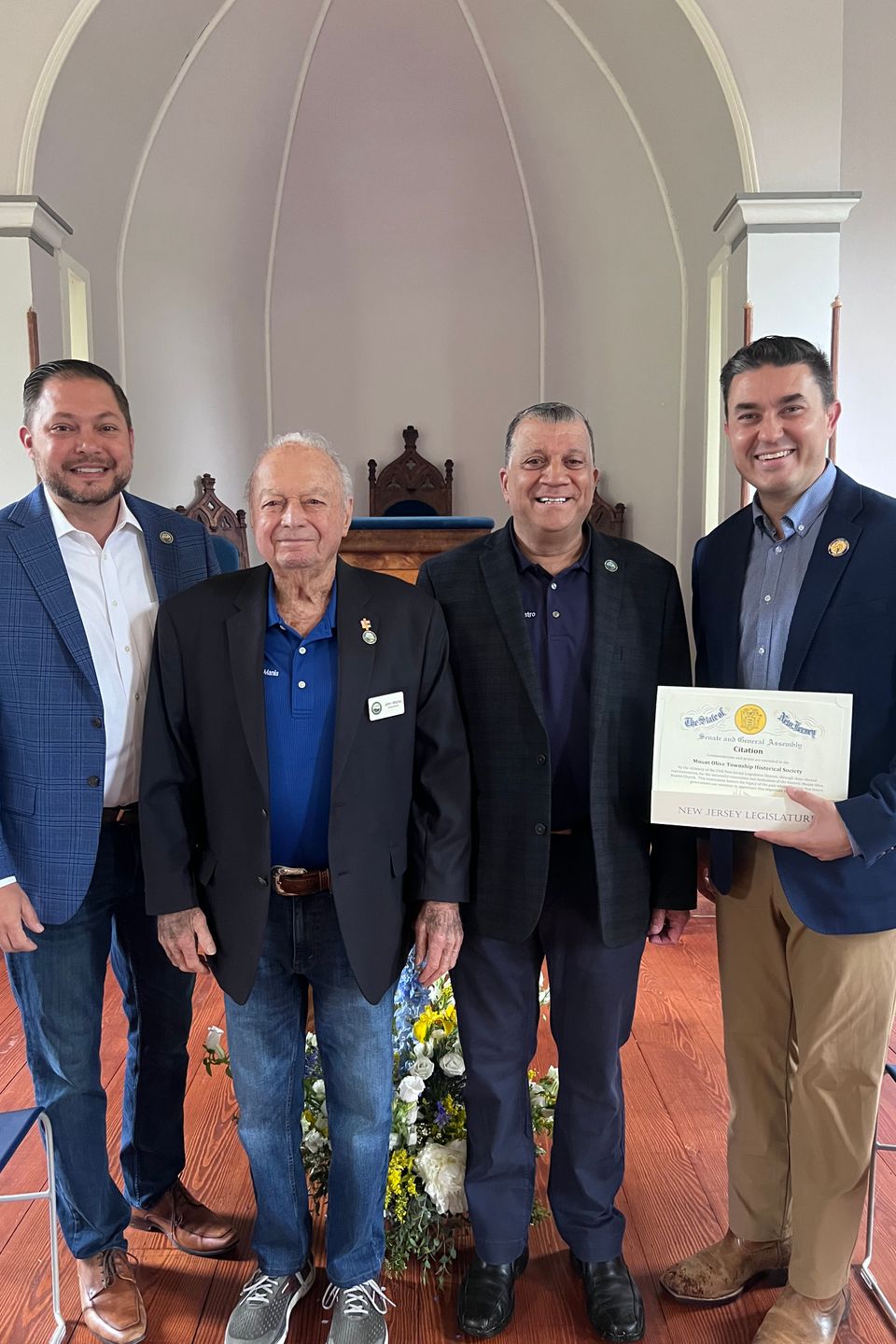 Andrew tatarenko  councilman john mania  mayor joe nicastro  and assemblyman mike inganamort presenting a citation for the dedication of the baptist church 