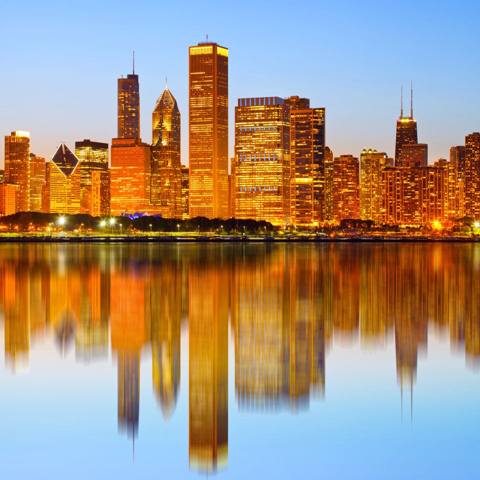 City of Chicago USA, colorful sunset panorama skyline of downtown with illuminated business buildings with reflections