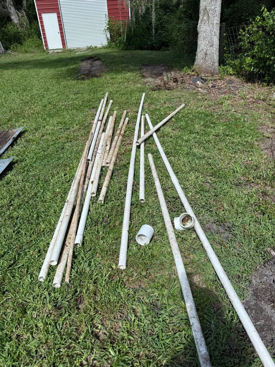 Scrap metal laid out on the grass