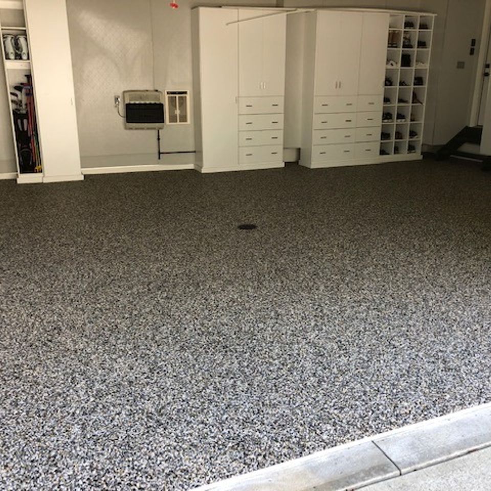Large residential garage with an EverStone decorative stone flooring system.