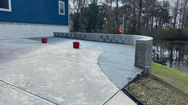 "Concrete driveway professionally constructed by Gabino Landscaping in Myrtle Beach, South Carolina."