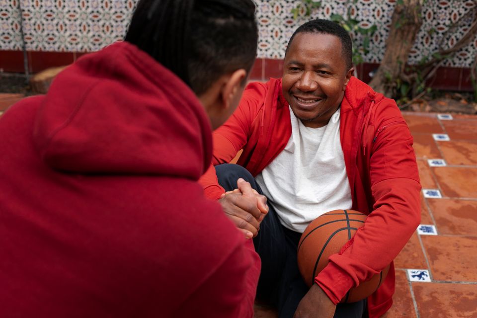 High angle friends playing basketball