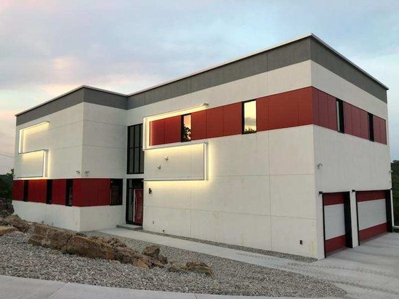 Symphony house front view of exterior with lighted s 