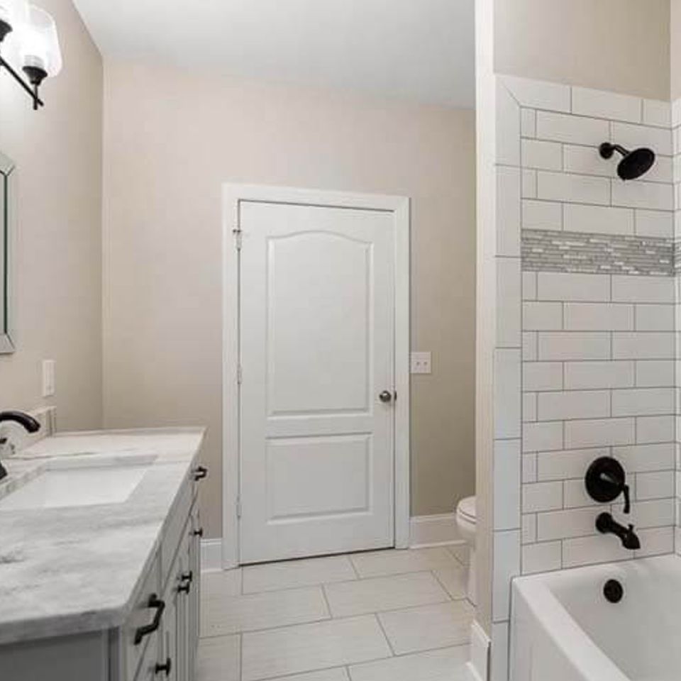 Spa-inspired bathroom with rainfall showerhead and custom lighting in Knoxville TN