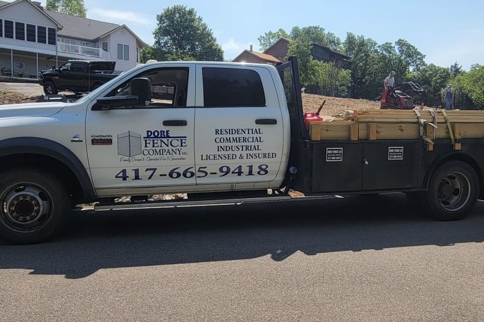 Dore fence co logo on work truck