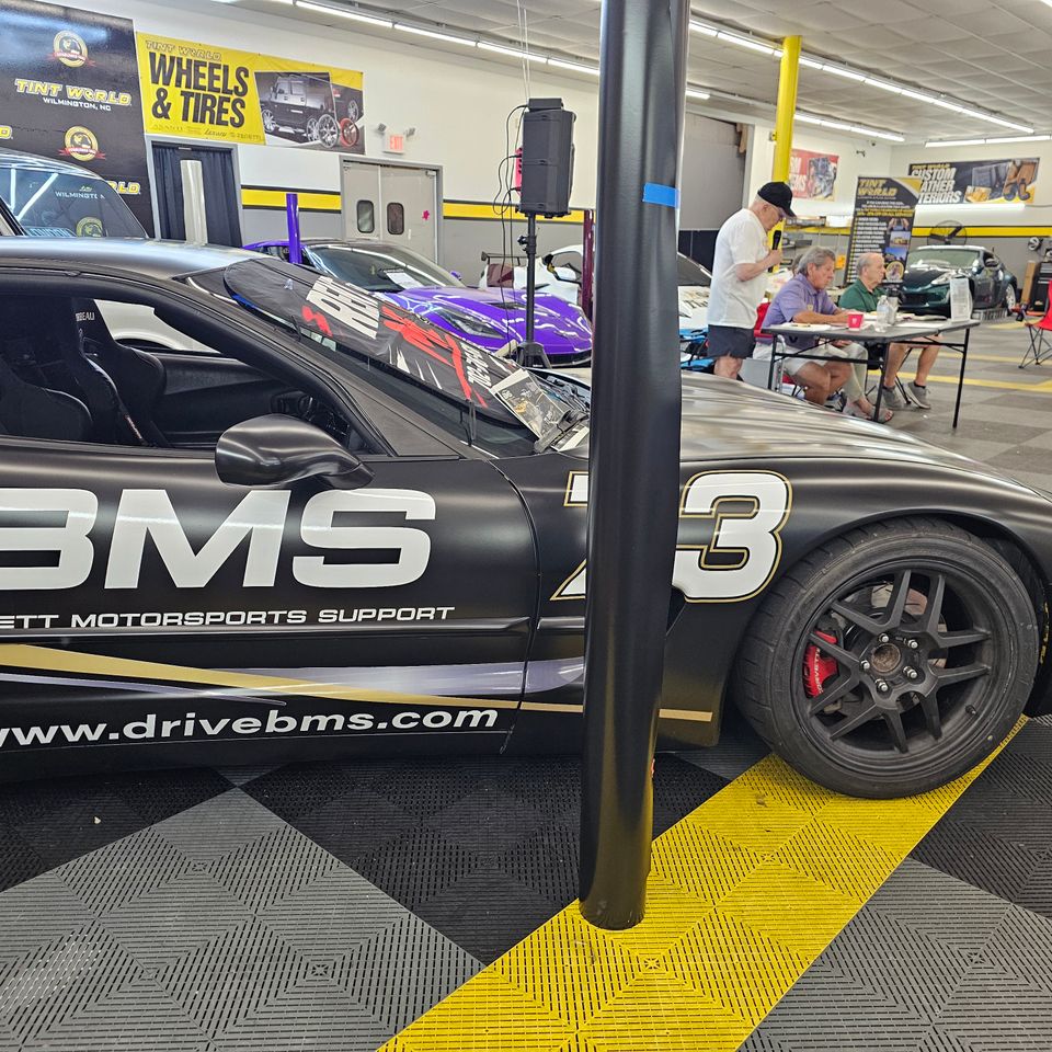 Close up view of the finalized BMS logo and Bennett Motorsports Support vinyl graphics on a vehicle
