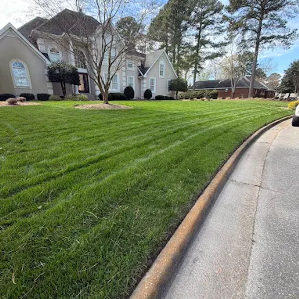 Far shot of cut grass for a client, done by Get A Mow On Lawn Care LLC of Chesapeake VA