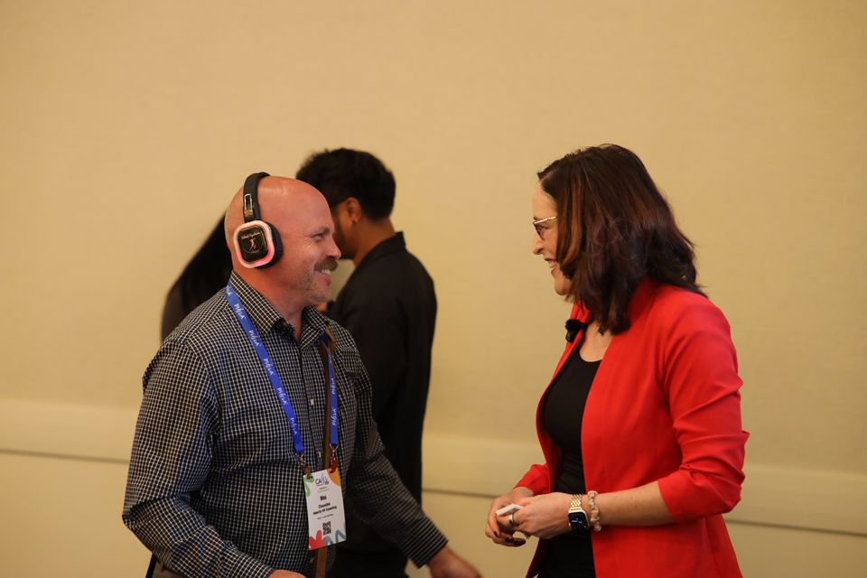 Man and woman standing talking